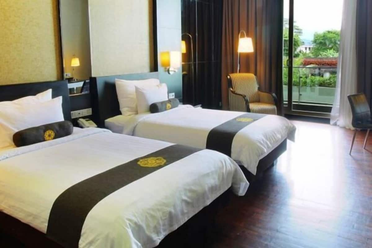 Luxe beddengoed, een minibar, een kluis op de kamer, een bureau
