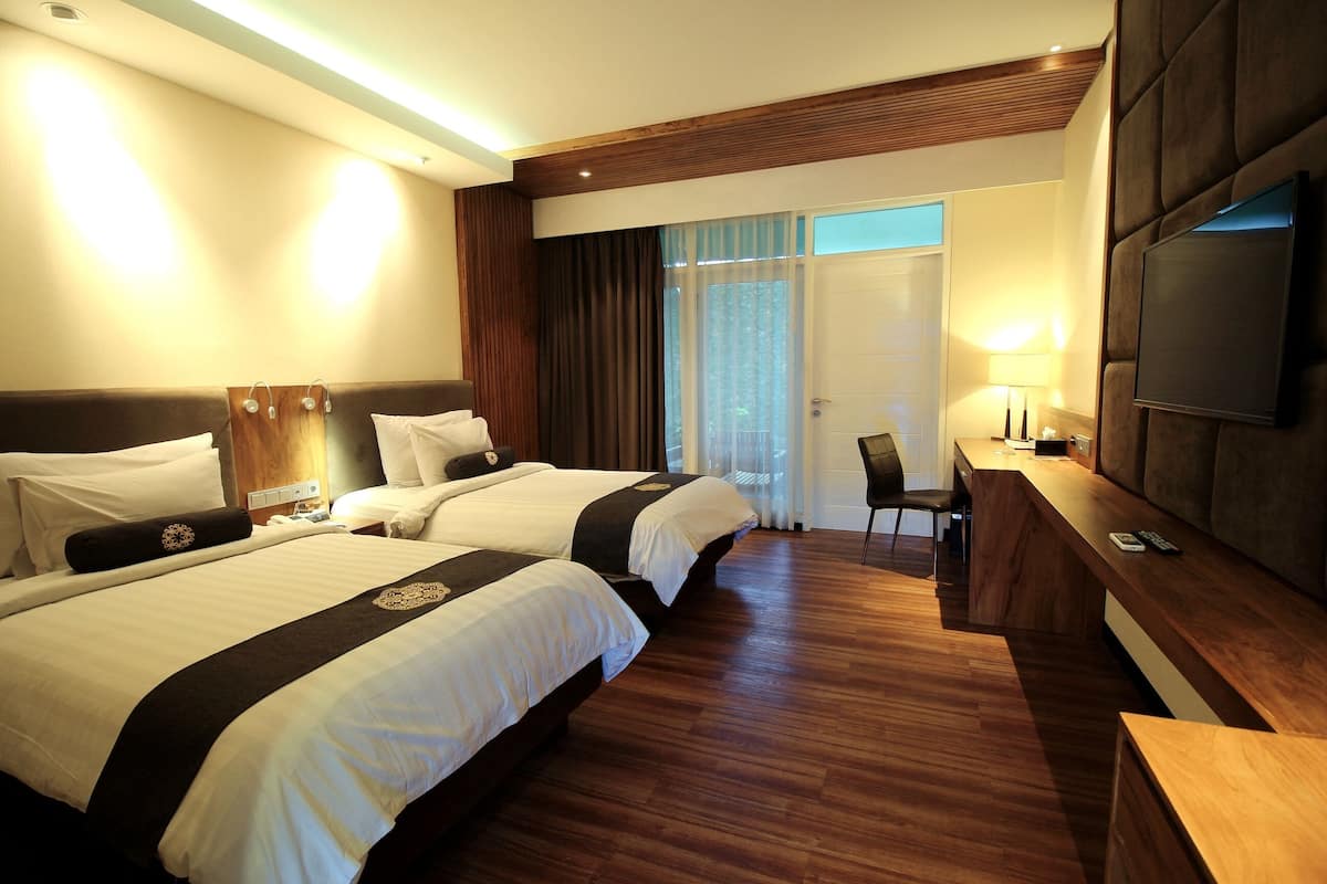 Deluxe cottage, 2 eenpersoonsbedden, uitzicht op tuin | Luxe beddengoed, een minibar, een kluis op de kamer, een bureau