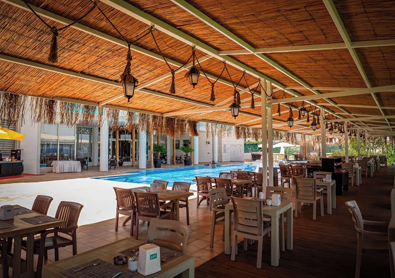 Seasonal outdoor pool, open 10:00 AM to 6:00 PM, pool umbrellas