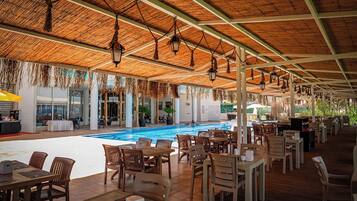 Seasonal outdoor pool, open 10:00 AM to 6:00 PM, pool umbrellas