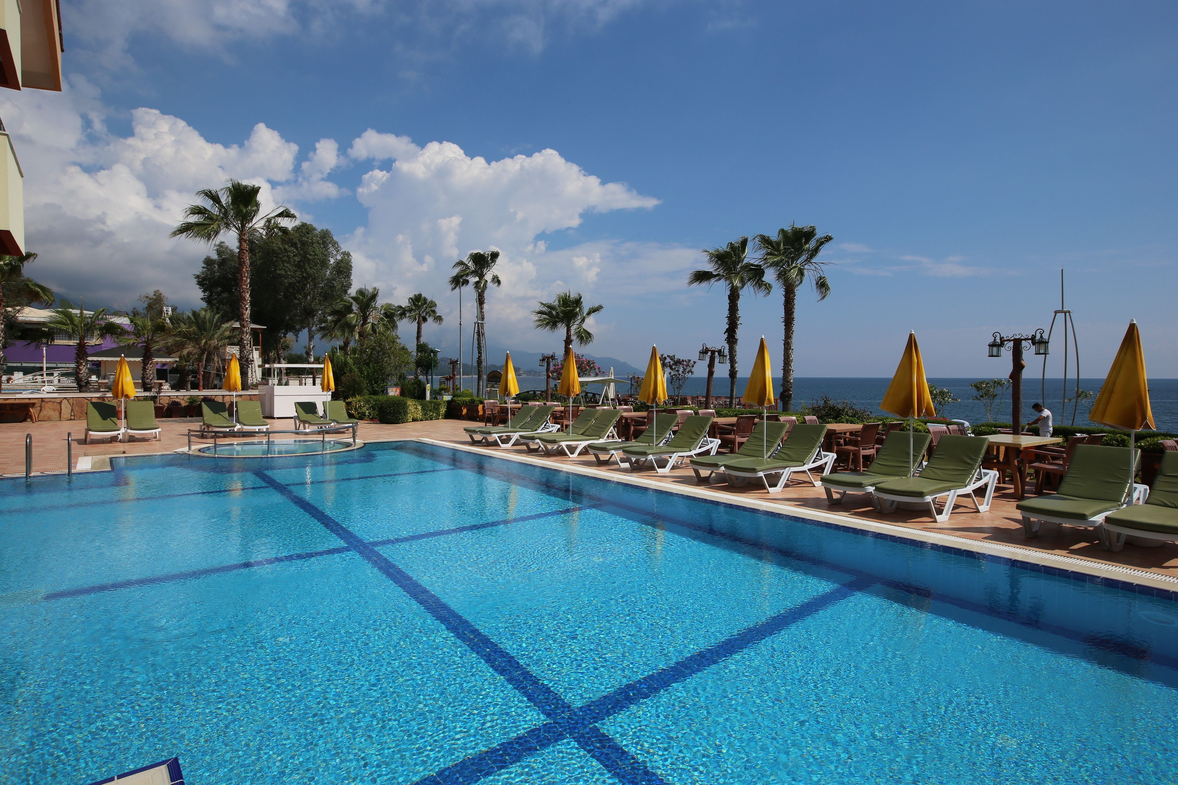 Seasonal outdoor pool, open 10:00 AM to 6:00 PM, pool umbrellas