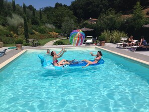 Seasonal outdoor pool, pool umbrellas, pool loungers
