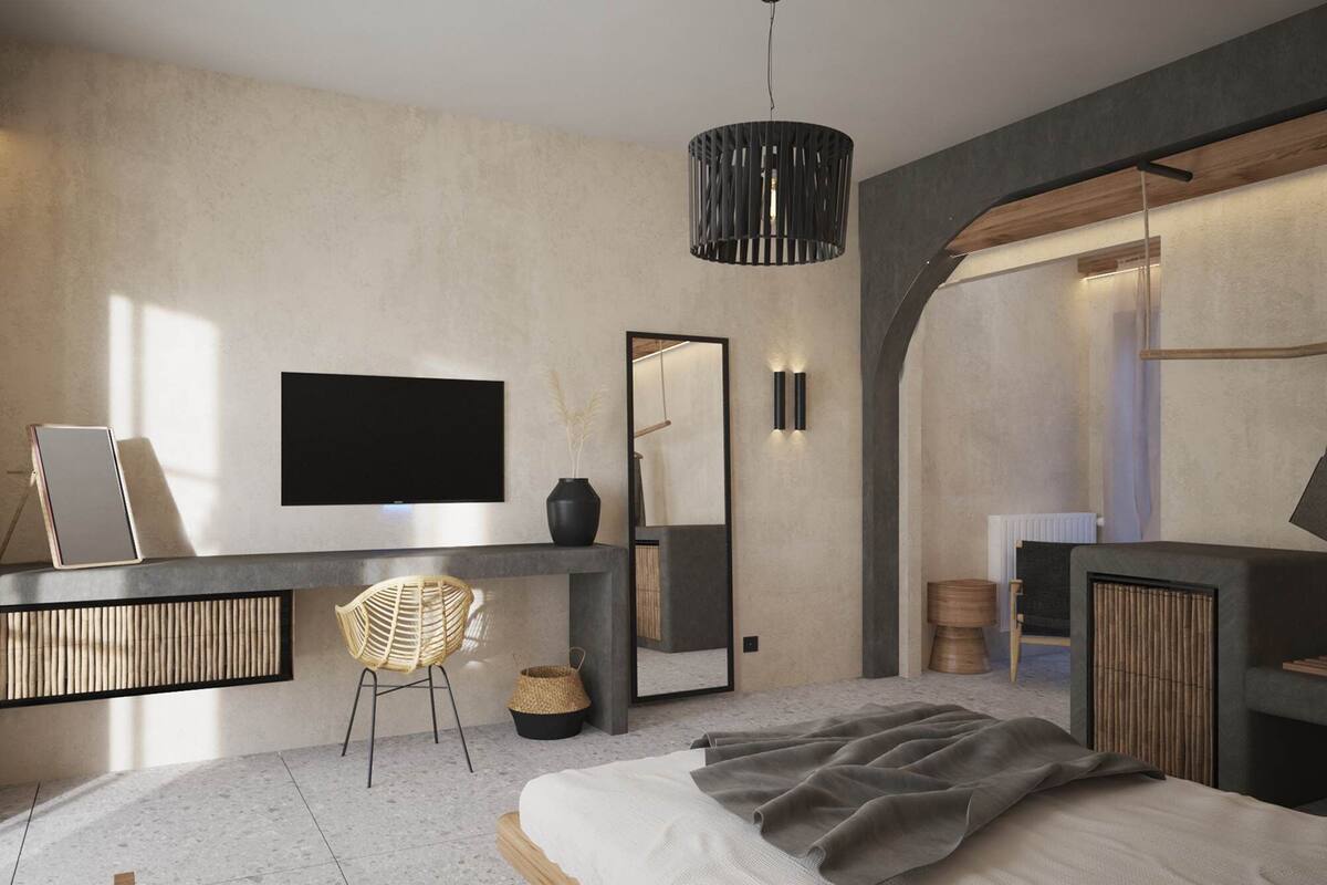 A modern bedroom with a bed, a desk, a chair, a TV, and a mirror.