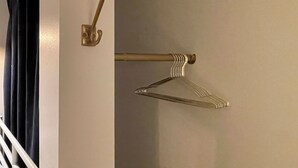 A wall-mounted coat rack with a hook and a metal hanger. - Crafoord Place - Hostel (Stockholm)