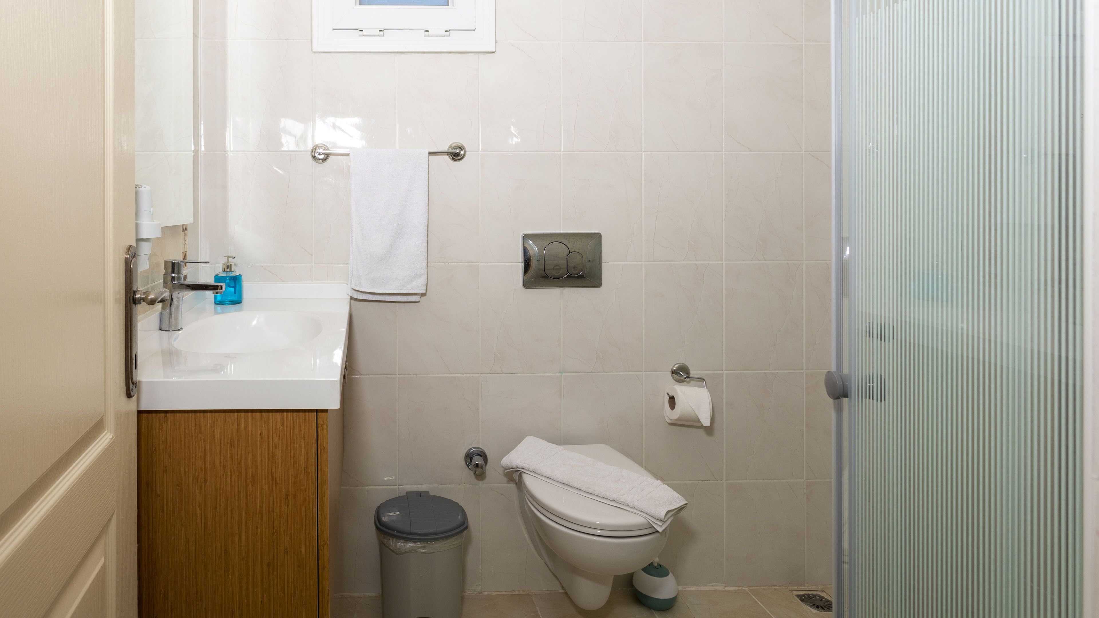 luxury apartment | bathroom | shower, hair dryer, slippers, towels