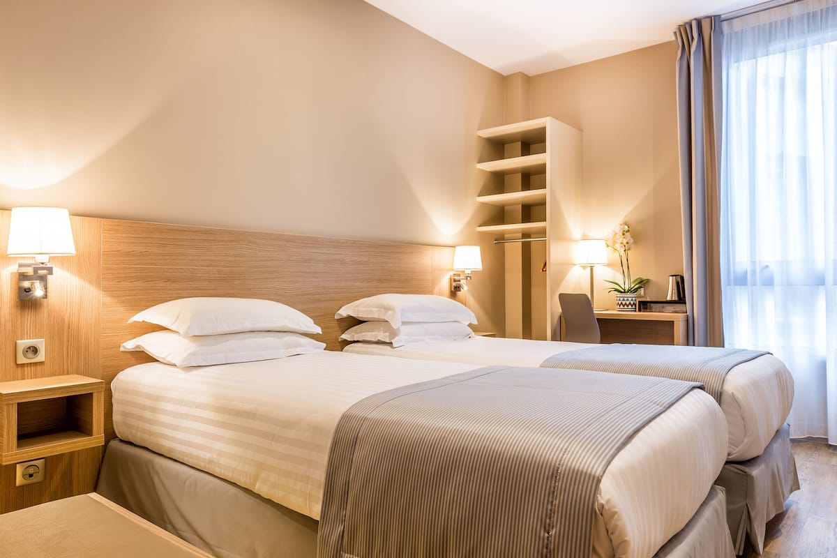 Superior Twin Room, Courtyard View | In-room safe, desk, soundproofing, iron/ironing board