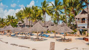 On the beach, sun loungers, beach umbrellas, beach towels