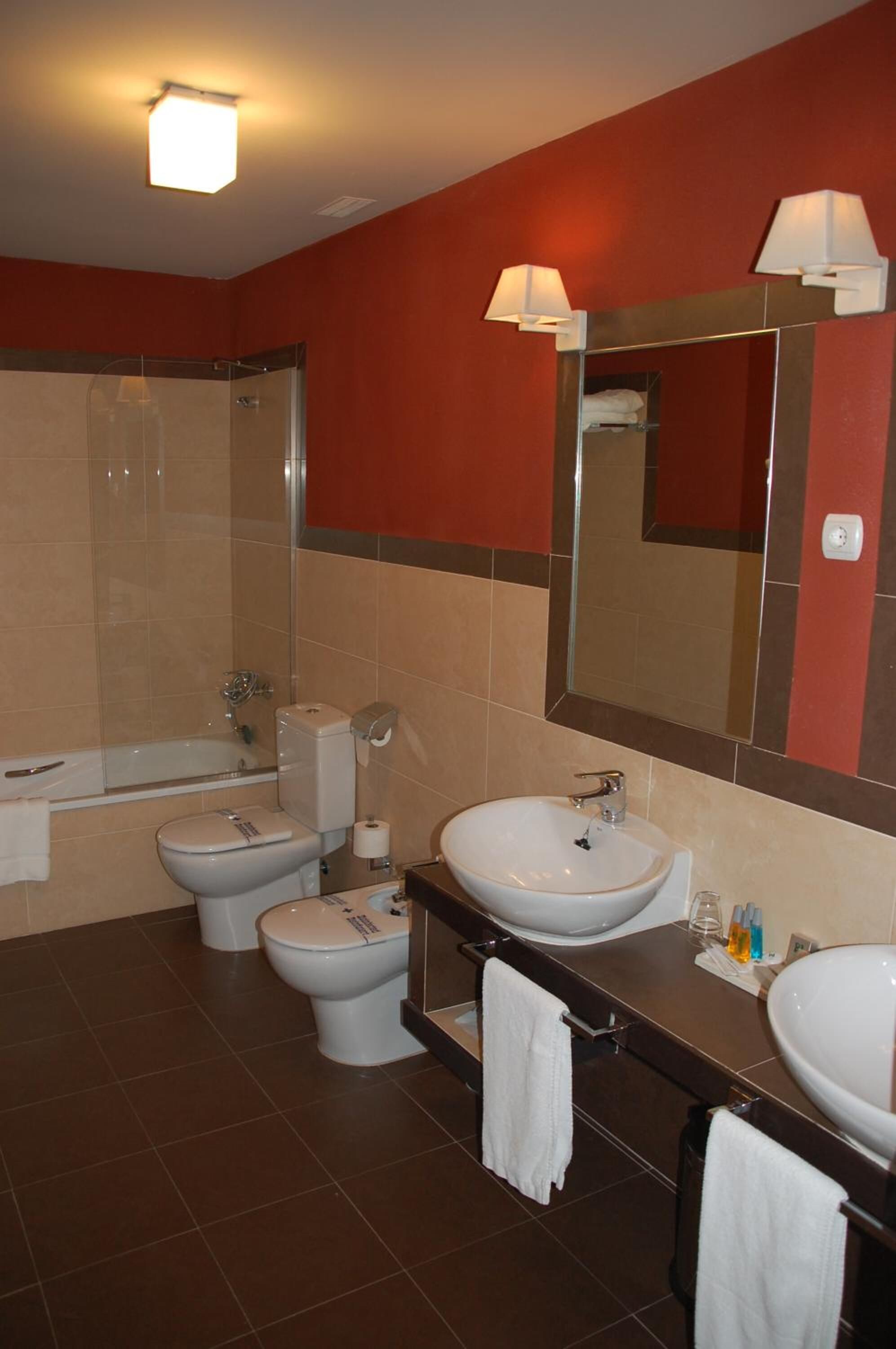 bathtub, free toiletries, hair dryer, towels