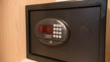 A digital safe with a keypad and a display screen.