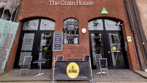 A red brick building with multiple windows and a sign reading "The Grain House". - YHA Bristol - Hostel (Bristol)