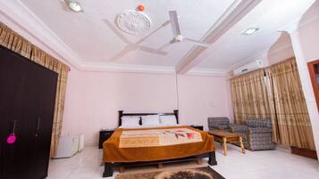 City Suite, 1 King Bed, City View | 4 bedrooms, in-room safe, desk, free WiFi