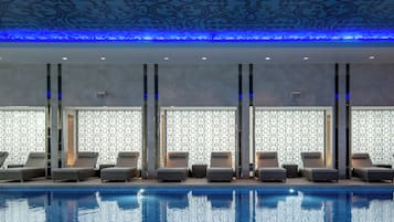 Indoor pool, open 7:00 AM to 9:00 PM, pool loungers