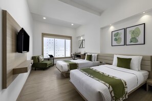 Luxe beddengoed, een minibar, een kluis op de kamer, een bureau