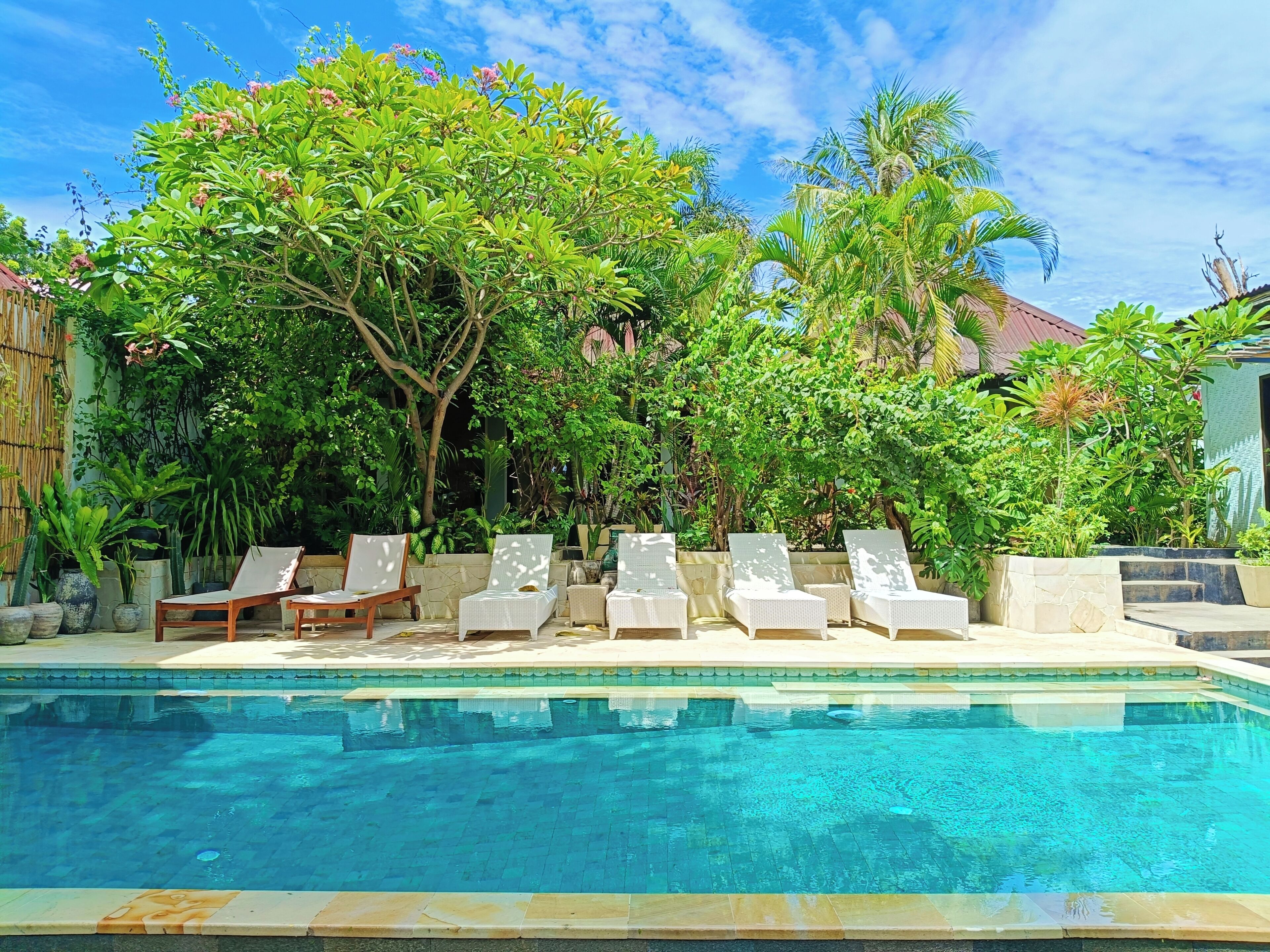 outdoor pool, open 9:00 am to 9:00 pm, pool umbrellas, pool loungers