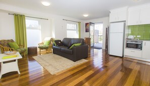 Apartment, 1 Bedroom | Living room | Flat-screen TV