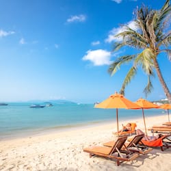 On the beach, sun-loungers, beach umbrellas, beach towels