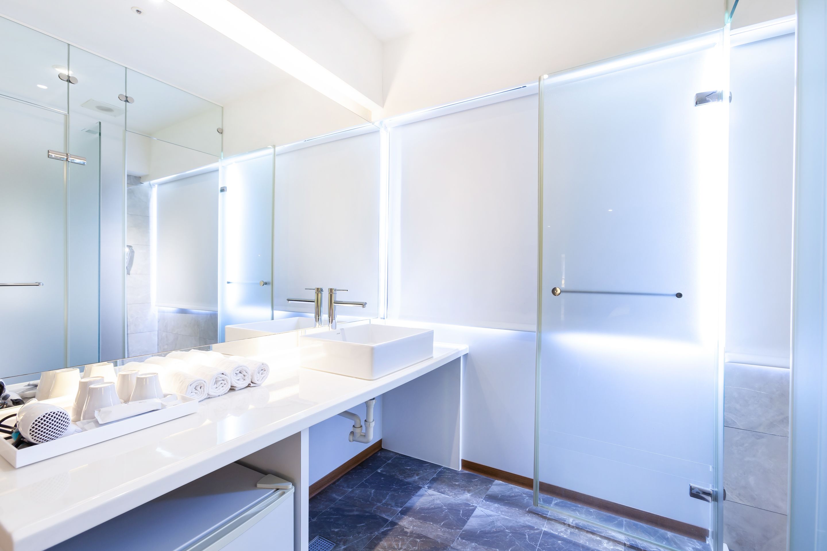 standard quadruple room | bathroom | shower, hair dryer, slippers, towels