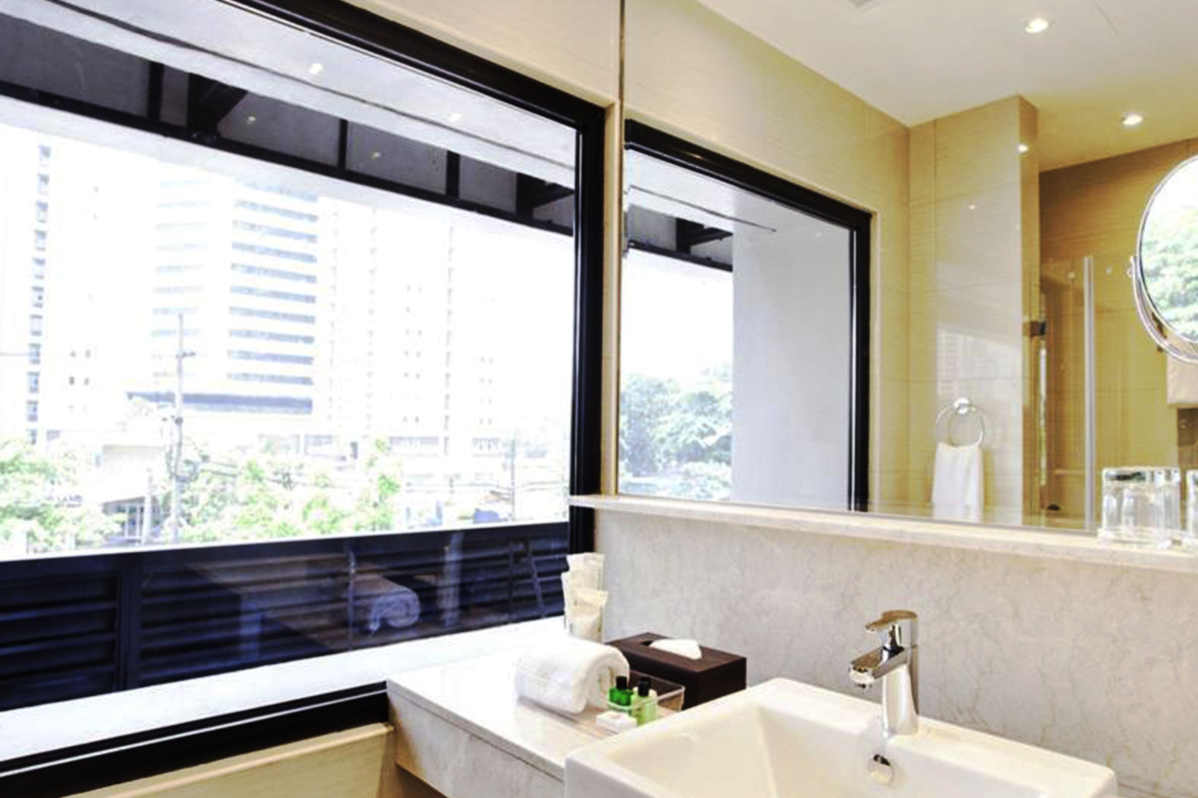 business room suite | bathroom | shower, free toiletries, hair dryer, bathrobes