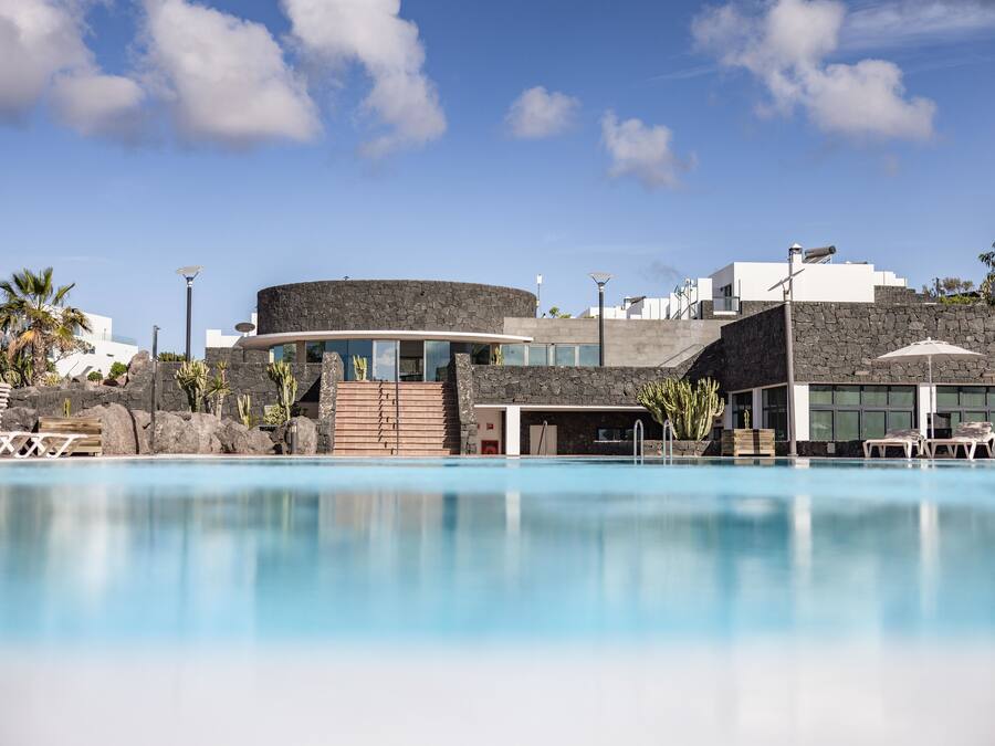 Outdoor pool, open 10:00 AM to 6:00 PM, pool umbrellas, sun loungers