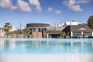 Outdoor pool, open 10:00 AM to 6:00 PM, pool umbrellas, sun loungers