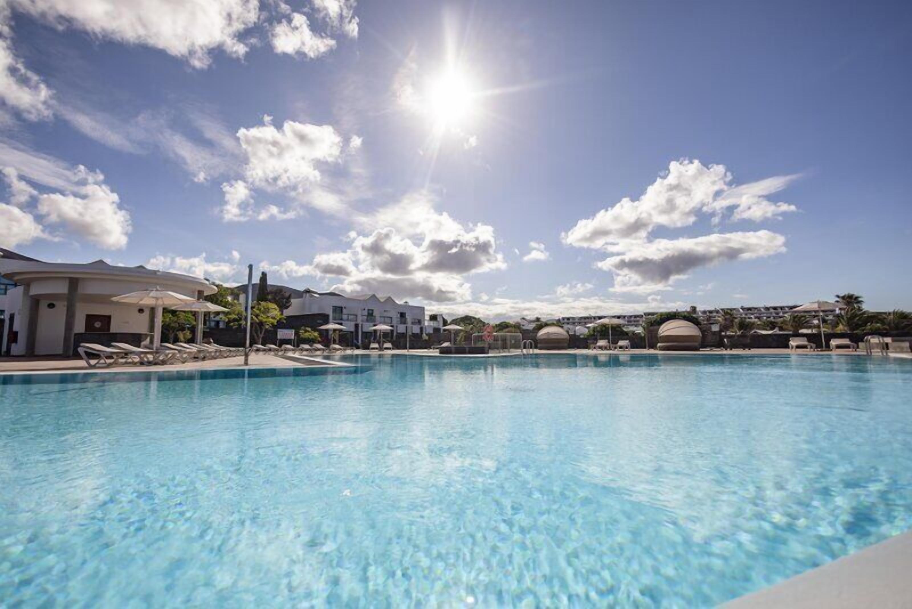 Outdoor pool, open 10:00 AM to 6:00 PM, pool umbrellas, pool loungers