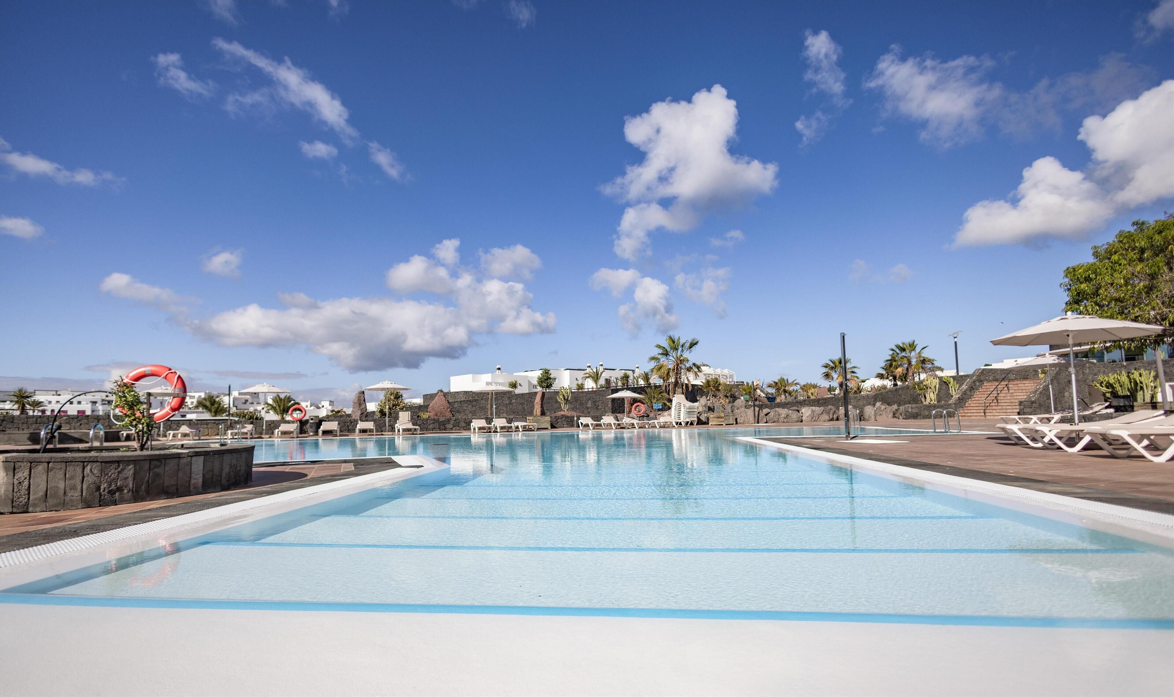 Outdoor pool, open 10:00 AM to 6:00 PM, pool umbrellas, sun loungers