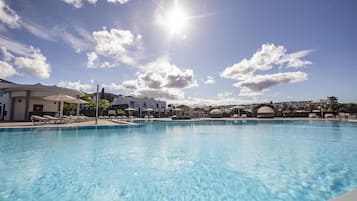 Outdoor pool, open 10:00 AM to 6:00 PM, pool umbrellas, sun loungers