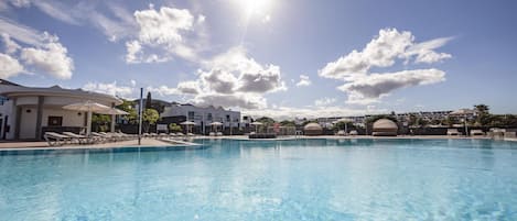 Outdoor pool, open 10:00 AM to 6:00 PM, pool umbrellas, pool loungers