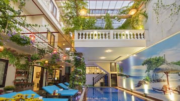 Indoor pool, outdoor pool, open 7 AM to 9 PM, pool umbrellas