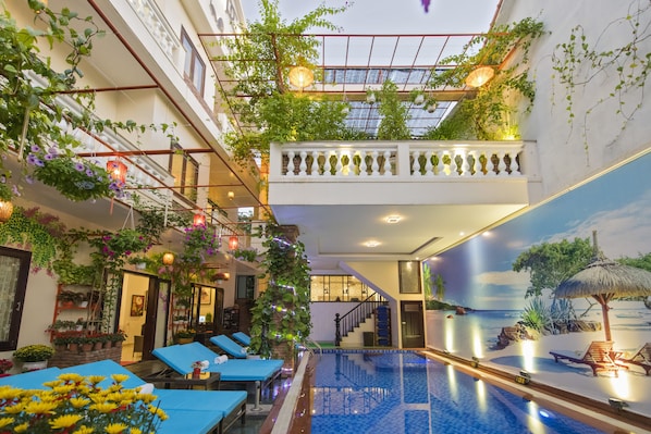 Indoor pool, outdoor pool, open 7 AM to 9 PM, pool umbrellas