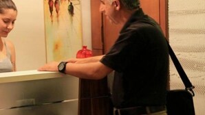 A reception desk with a person standing behind it. - Tamara Suite Hotel (Istanbul)
