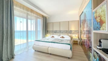 Junior Suite, Side Sea View (Free Beach Access, Safe, Minibar) | Free minibar, in-room safe, desk, bed sheets