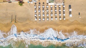 On the beach, beach cabanas, sun-loungers, beach umbrellas