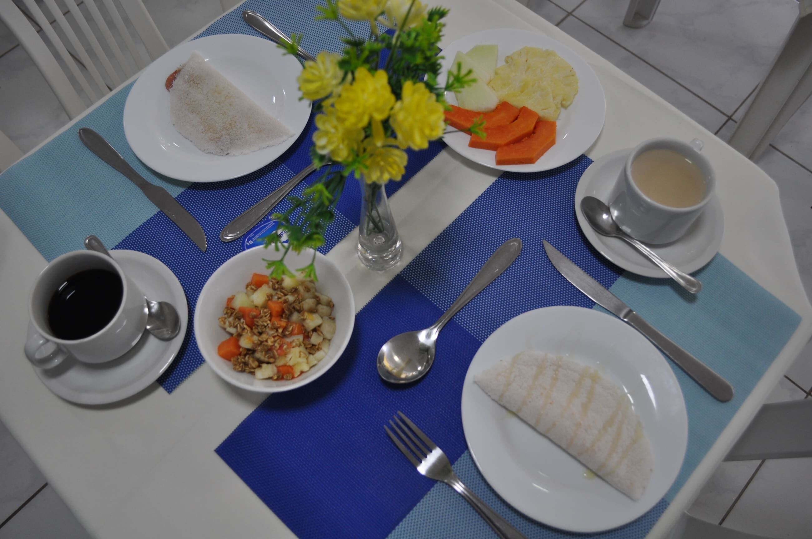 A table set with a white plate of rice, a white plate of vegetables, a white plate of potatoes, a white plate of fish, a white cup of coffee, a white cup of tea, a white cup of water, a white bowl of salad, a white bowl of rice, a white plate of bread, a white plate of fruit, a white plate of meat, a white plate of cheese, a white plate of pasta, a white plate of soup, a white plate of eggs, a white plate of vegetables, a white plate of fish, a white plate of meat, a white plate of cheese, a white plate of pasta, a white plate of soup, a white plate of eggs, a white plate of vegetables, a white plate of fish, a white plate of meat, a white plate of cheese, a white plate of pasta, a white plate of soup, a white plate of eggs, a white plate of vegetables, a white plate of fish, a