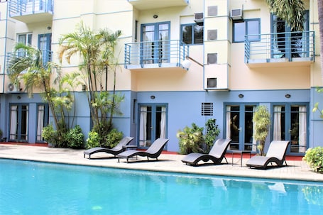 Outdoor pool, open 6:00 AM to 8:00 PM, pool umbrellas, sun loungers