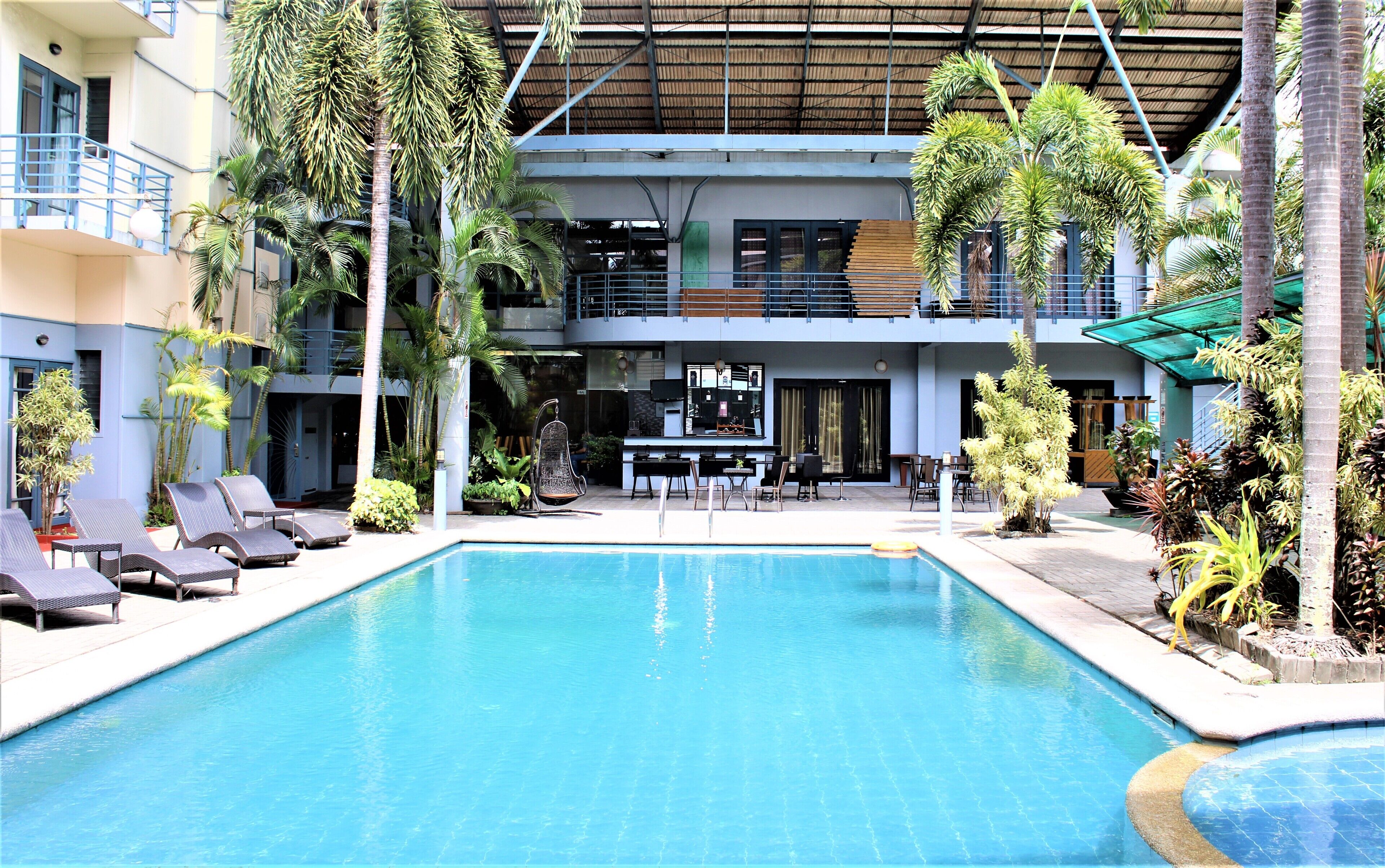 Outdoor pool, open 6:00 AM to 8:00 PM, pool umbrellas, pool loungers