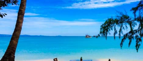 Private beach, white sand, sun loungers, beach umbrellas