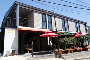 Enjoy a drink at the outdoor seating area, where umbrellas provide shade.