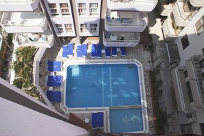 Seasonal outdoor pool, open 9:00 AM to 7:00 PM, pool umbrellas
