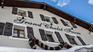 A building with the sign "Grand Chalet Faure" and a snow-covered ground. - Hotel Le Grand Chalet Favre (Anniviers)
