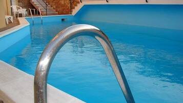 Outdoor pool, pool umbrellas, pool loungers
