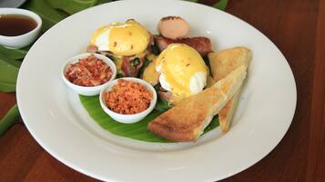 A plate of food with toast, eggs, and condiments.