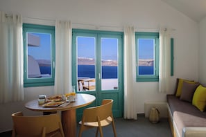 Premium Suite, Plunge Pool, Caldera view | Living room | Smart TV, MP3 dock, streaming services - Neptune Luxury Spa Suites (Santorini)