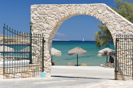 On the beach, sun loungers, beach umbrellas. Contaratos Beach