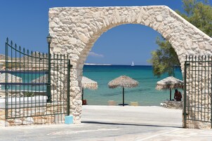 On the beach, sun loungers, beach umbrellas