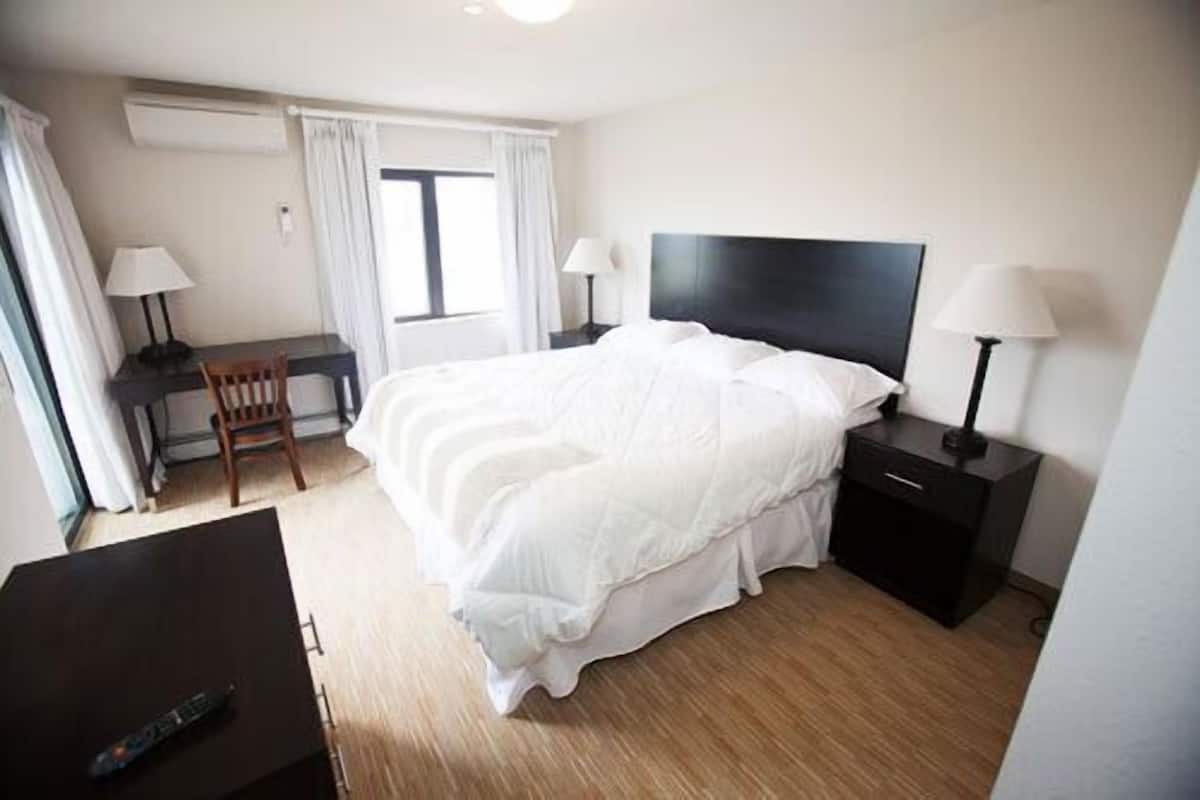 deluxe suite, 1 king bed with sofa bed, balcony, golf view | premium bedding, desk, iron/ironing board, free wifi