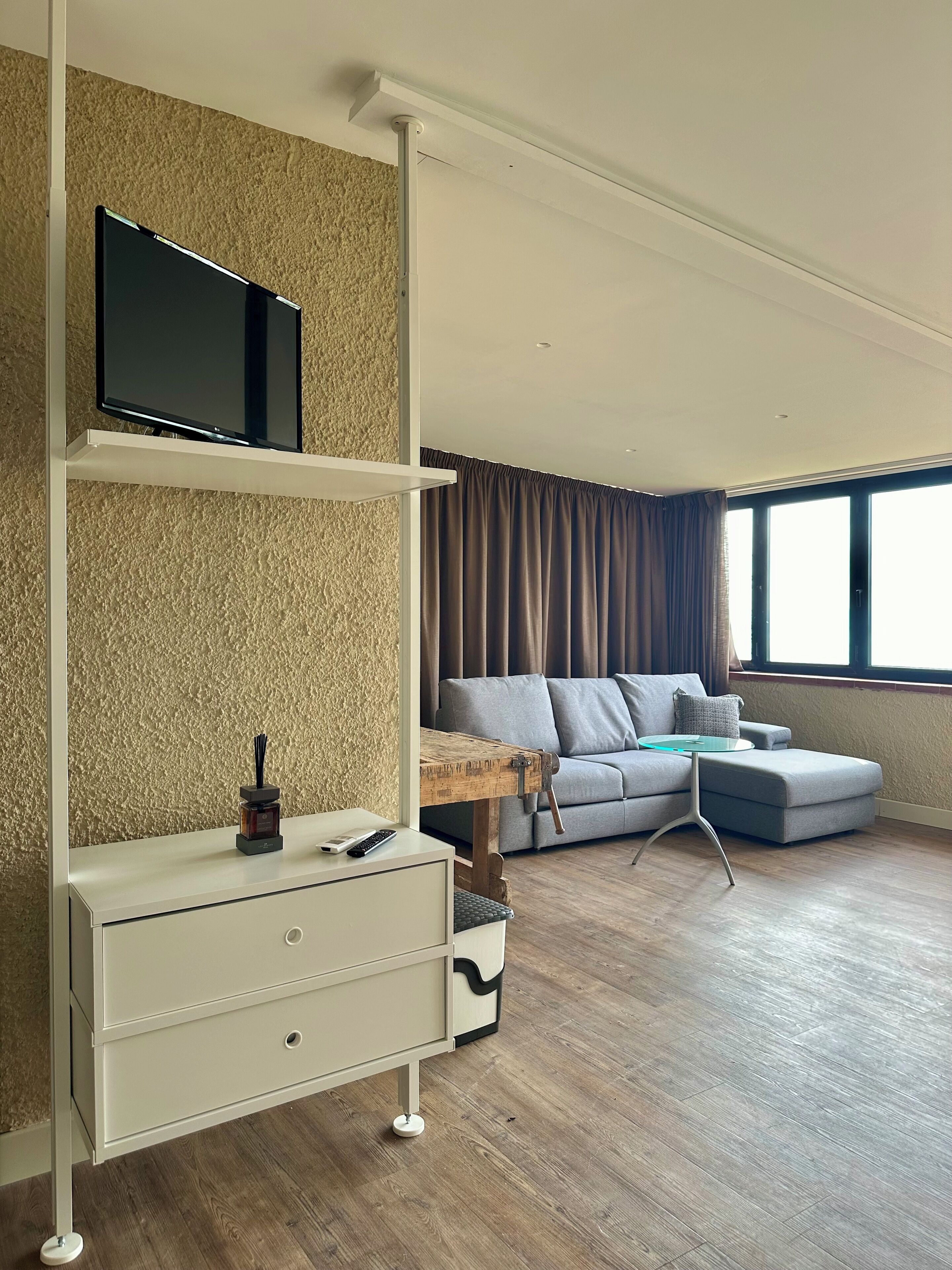 panoramic room, 1 king bed with sofa bed, non smoking, valley view | living area | 40-inch led tv with satellite channels, tv