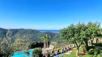 Seasonal outdoor pool, open 8:00 AM to 7:00 PM, pool umbrellas