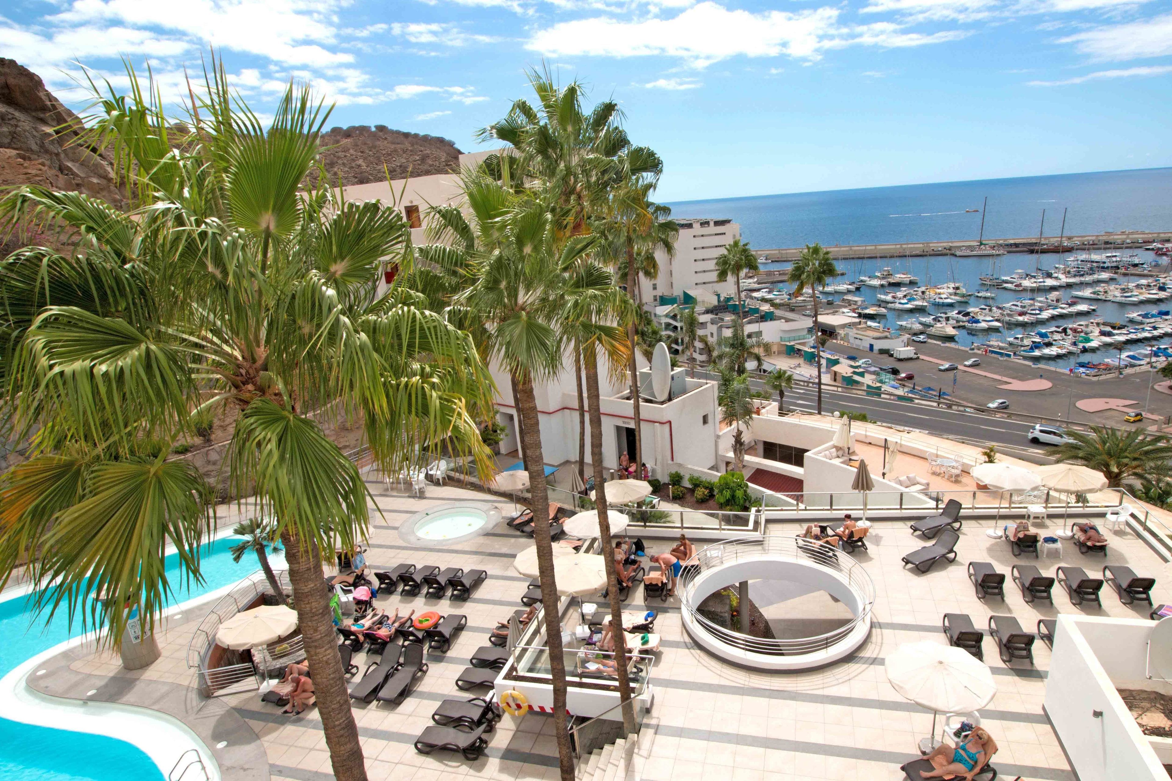 Outdoor pool, open 10:00 AM to 7:00 PM, pool umbrellas, sun loungers