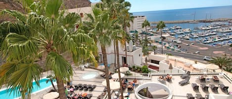 Outdoor pool, open 10:00 AM to 7:00 PM, pool umbrellas, sun loungers